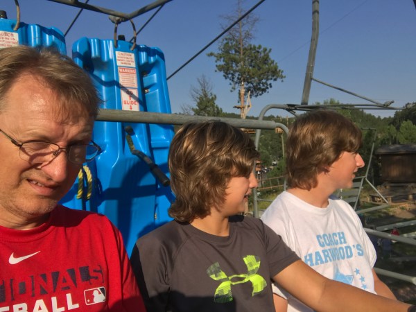Boys going up chairlift for alpine slide